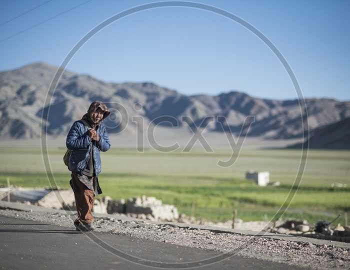Kashmiri Woman walking on Road