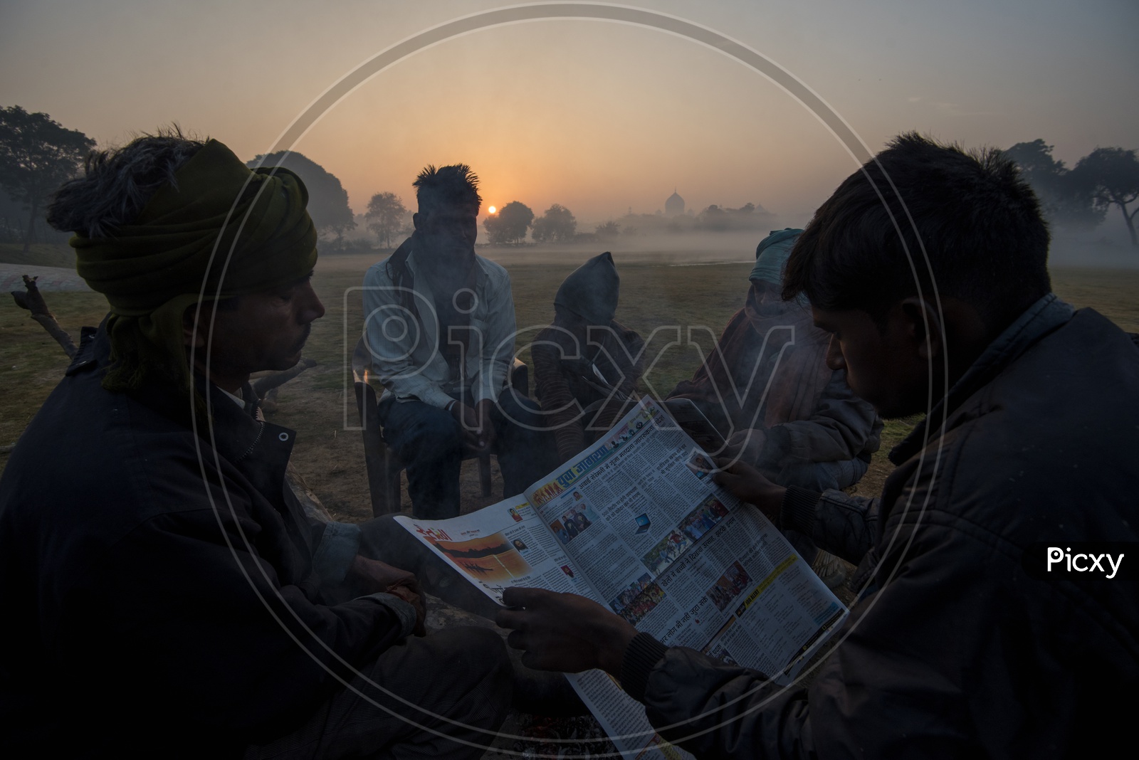 People reading News paper in Early Morning