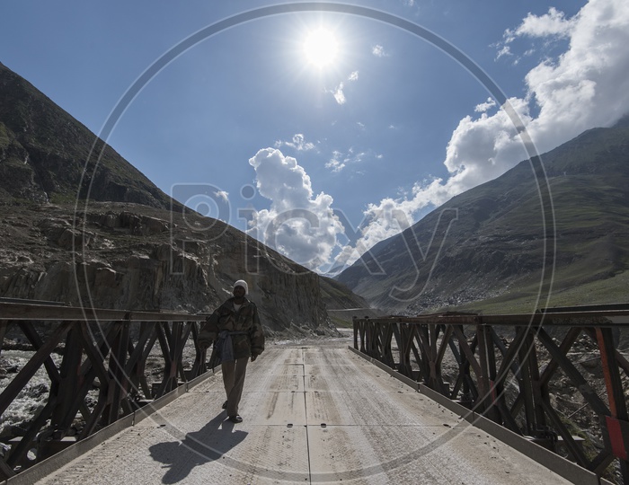 Man walking on Bridge in Leh