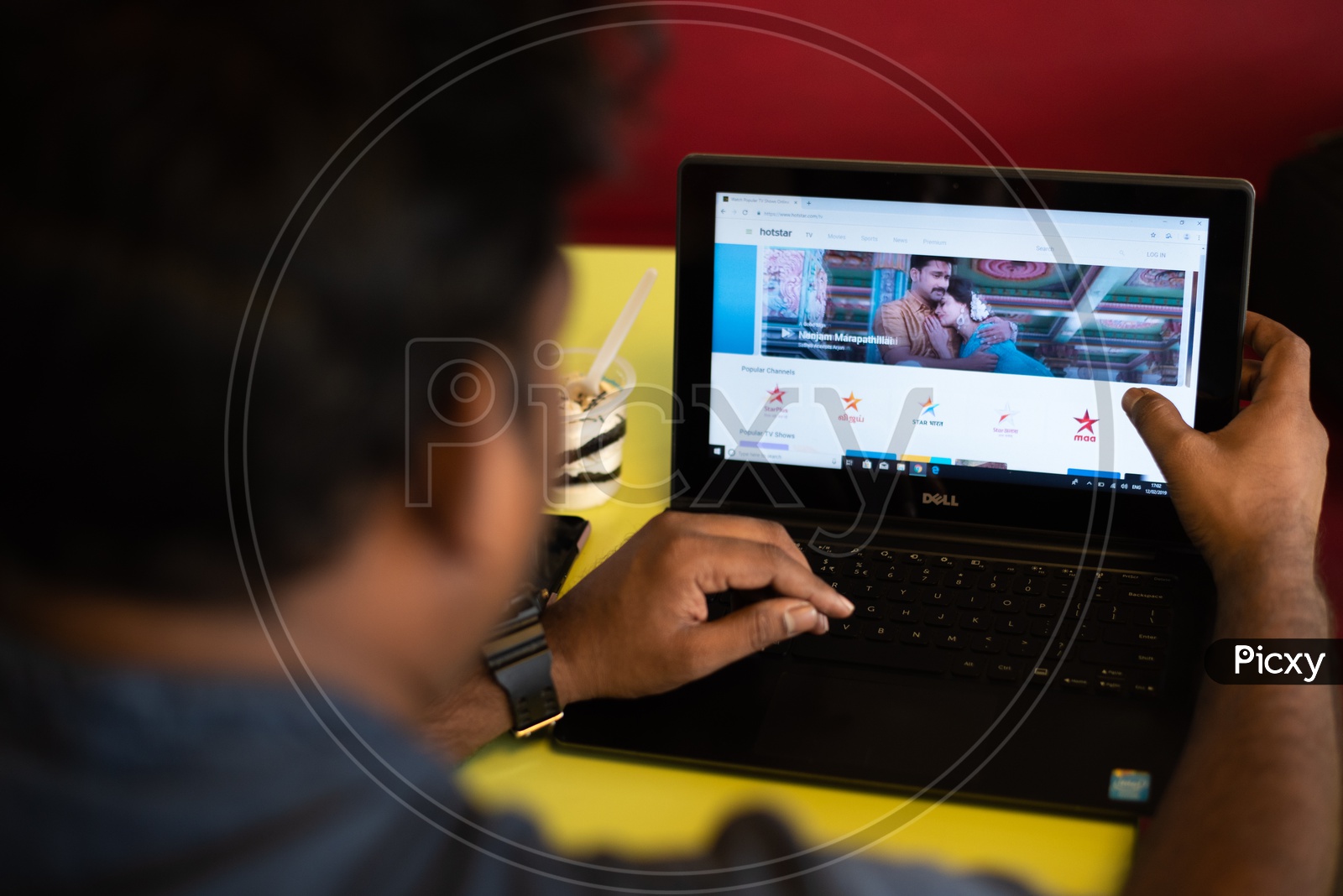 Indian Youth Searching Movies on  Hotstar   in Laptop