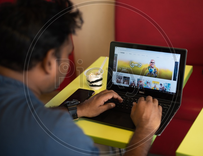 Indian Youth searching Movies on Hotstar in Laptop