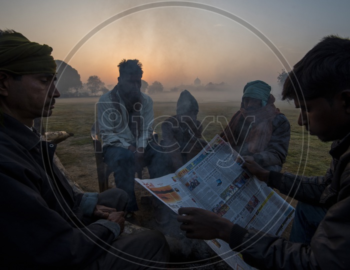 People reading News paper early Morning