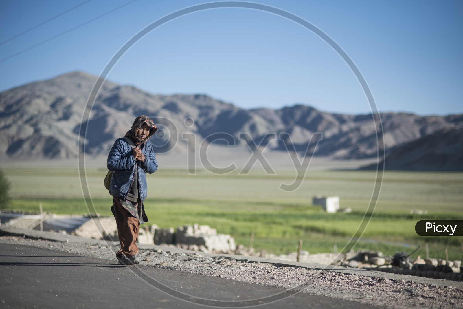 Kashmiri Woman walking on Road
