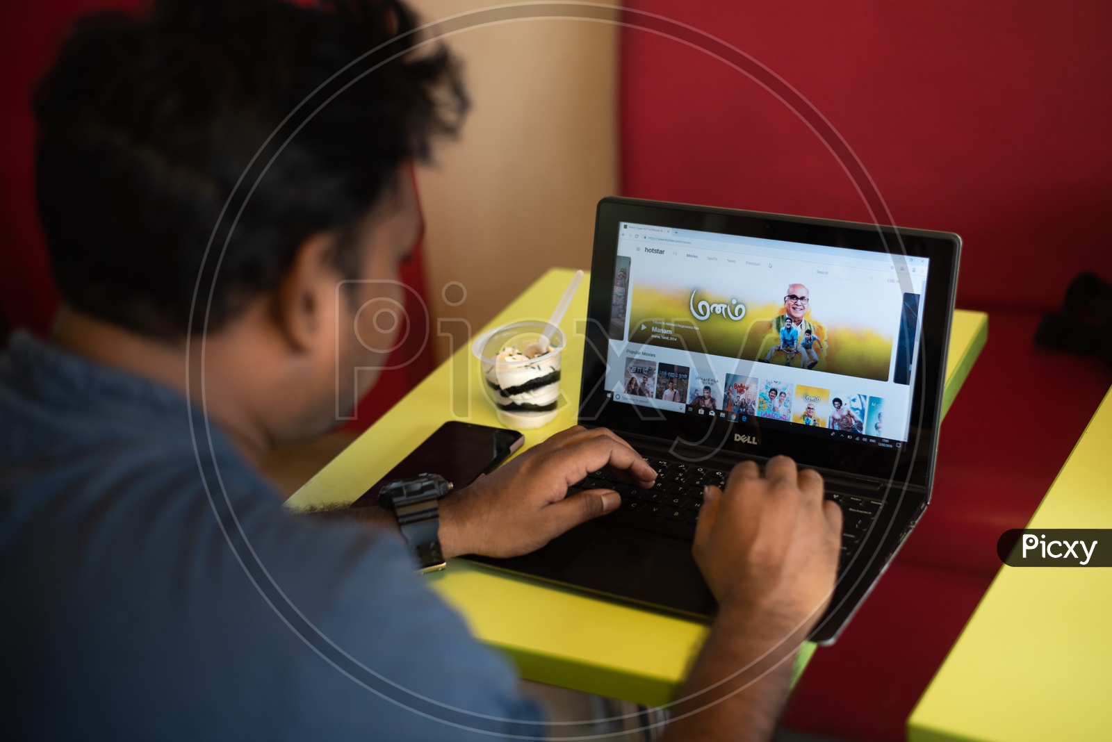 Indian Youth searching Movies on Hotstar in Laptop