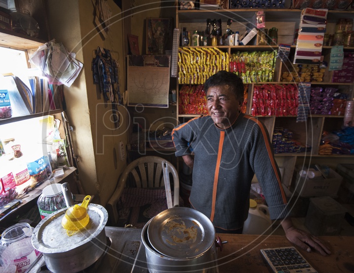 Smiling Kashmiri man in a Shop