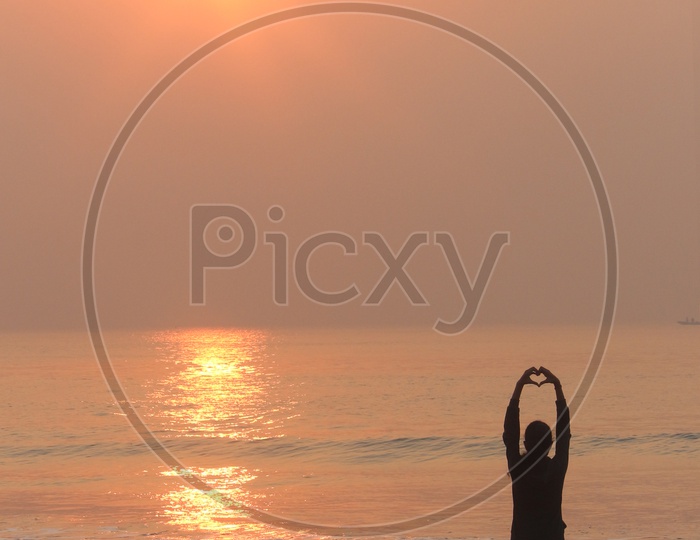A girl loving sunrise at RK beach