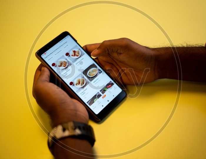 A man using Swiggy, an Online food delivery app