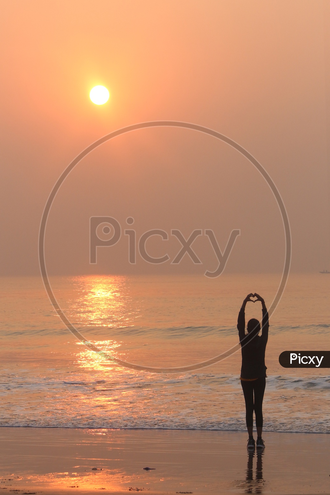 A girl loving sunrise at RK beach