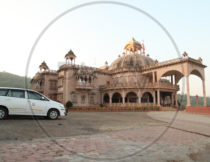 A car in front of a palace