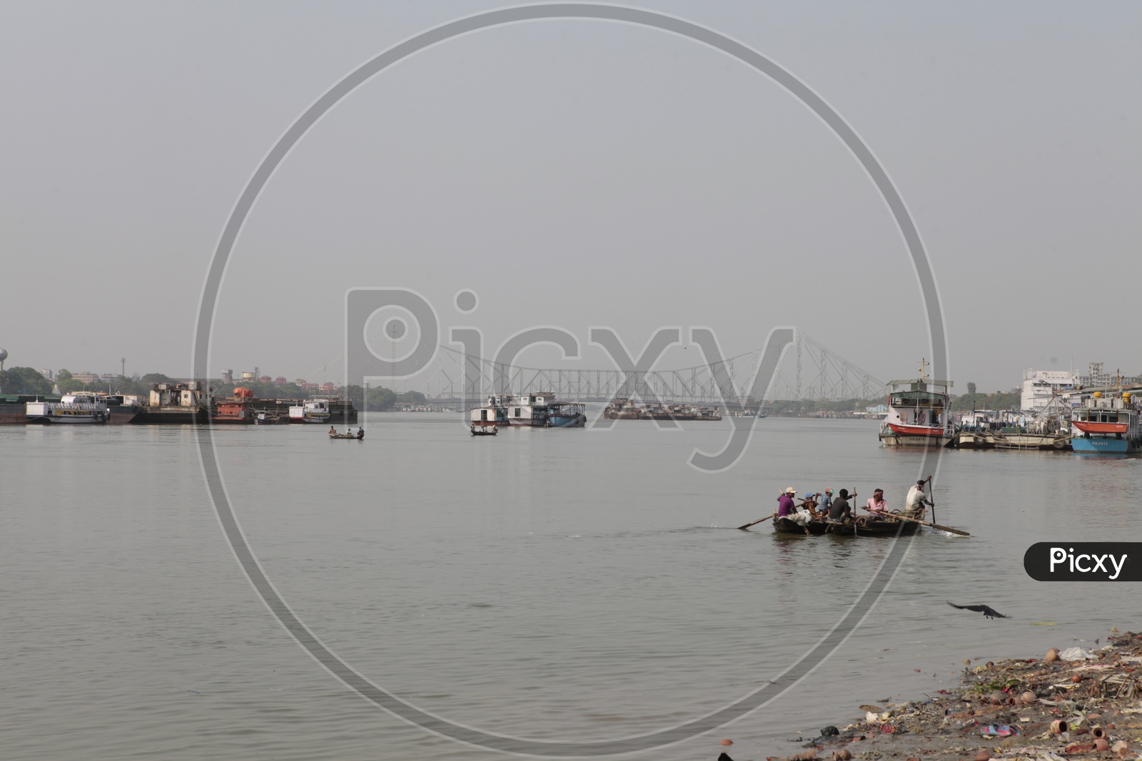 Local People sailing the boat in the Hooghly River
