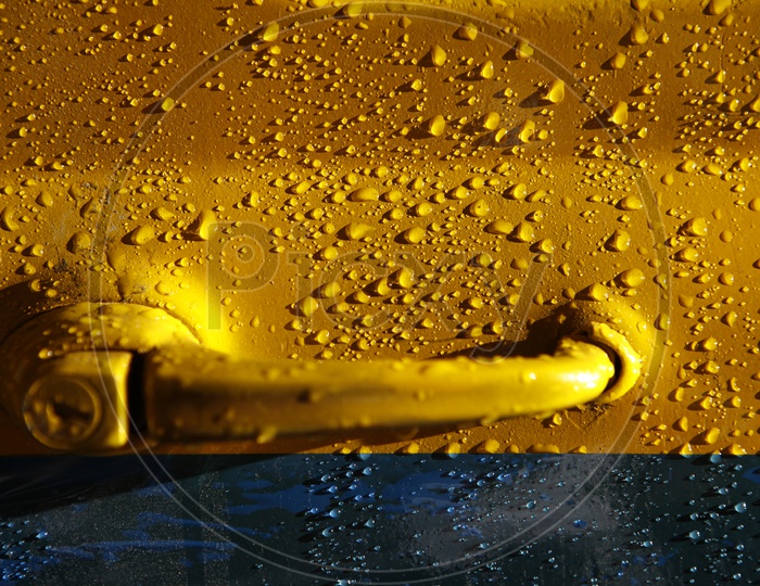 Water Droplets On a Car Door Closeup Shot