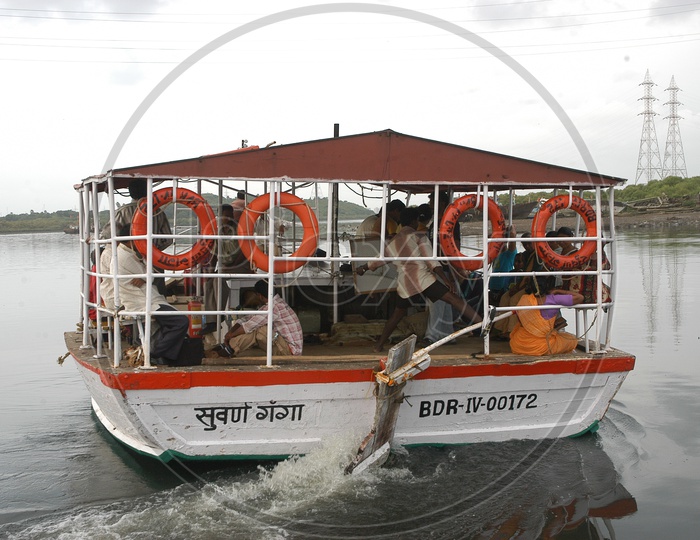 A boat with people moving on the river