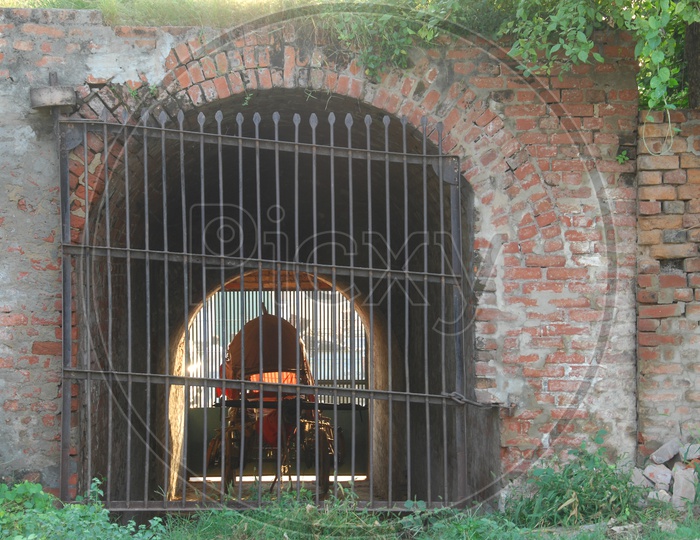 A chariot inside a building with large gates