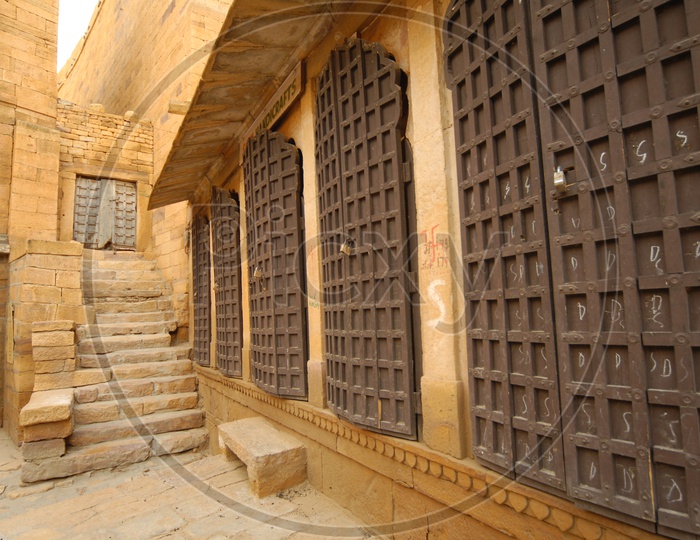 Staircase and arch shaped iron doors of an ancient building