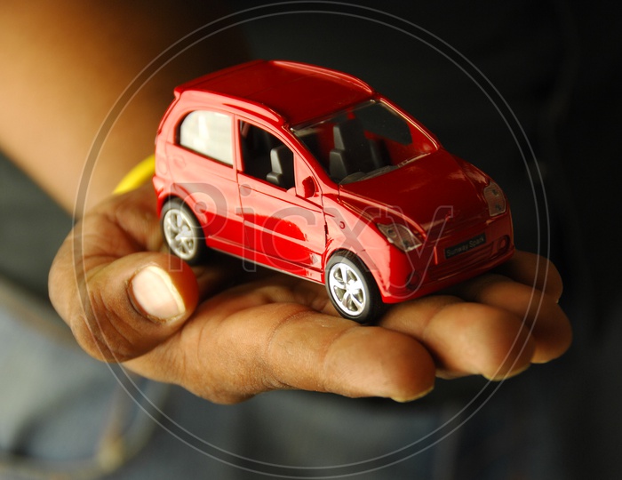A Car toy on a Hand
