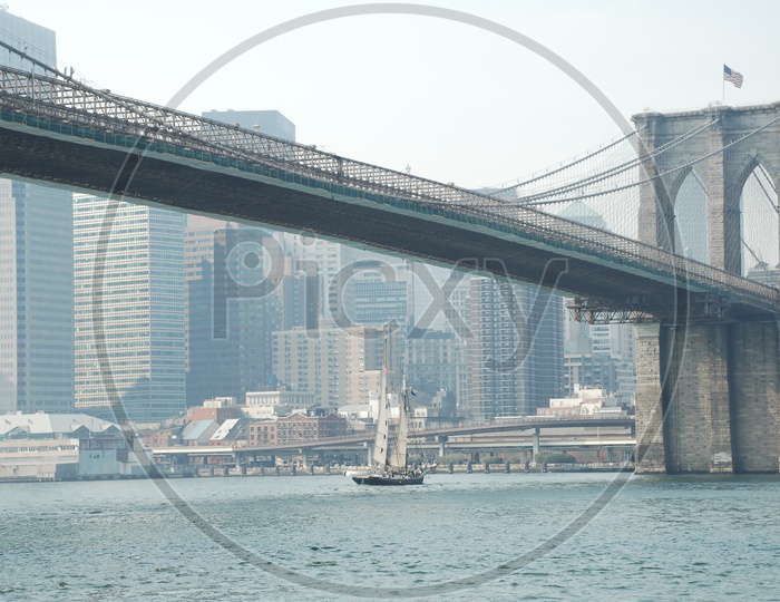 Beautiful view of Brooklyn bridge with river in the foreground  in New York City
