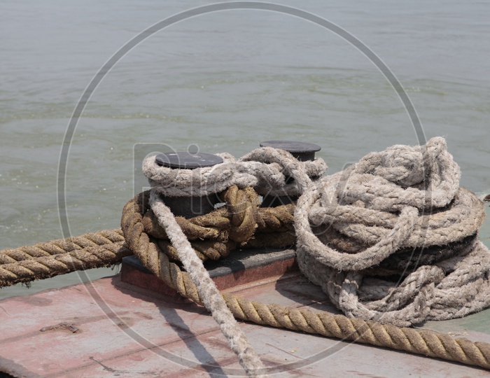Ropes tied to a ship alongside the Hooghly River