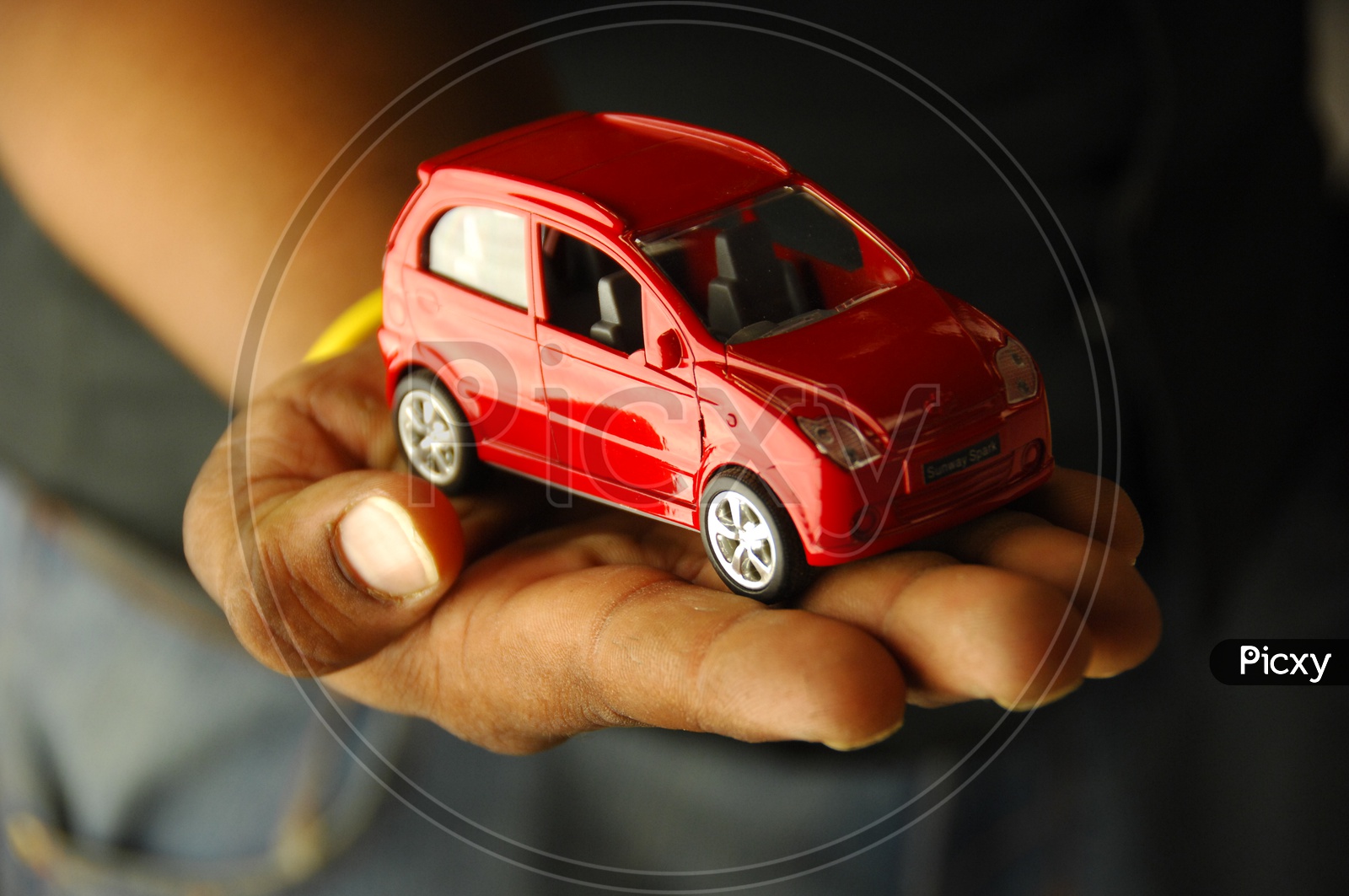 A Car toy on a Hand