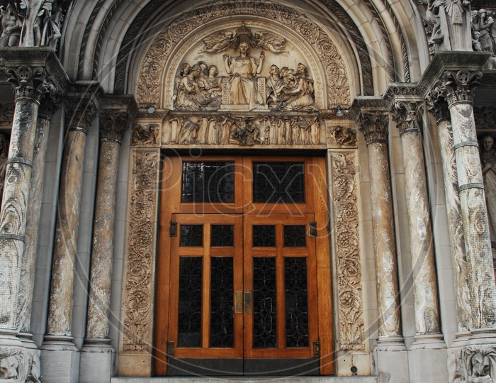 Entrance to a arch like building with wooden doors