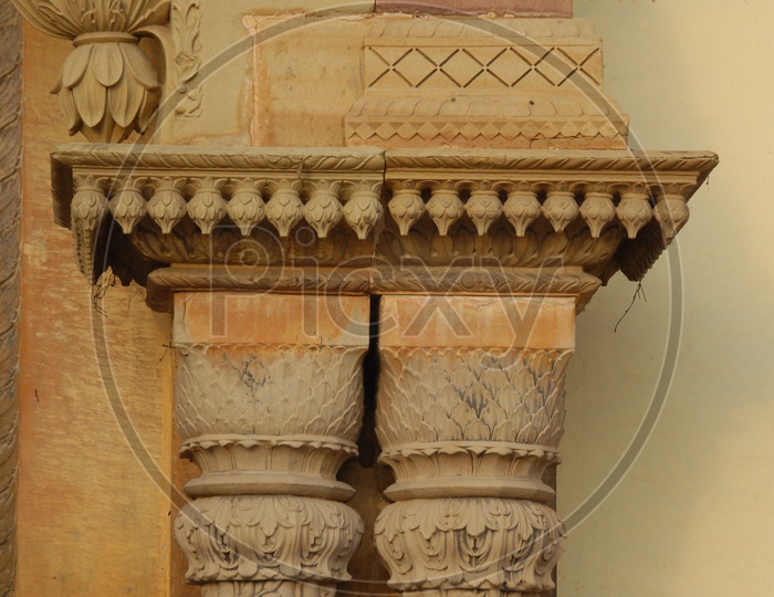Wall carvings on the pillars of an ancient building