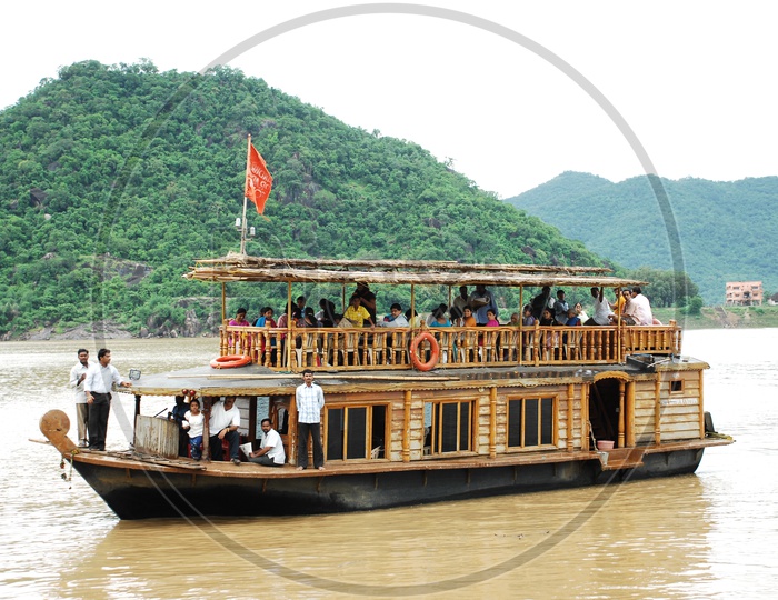 People take a ride on the river in a boat