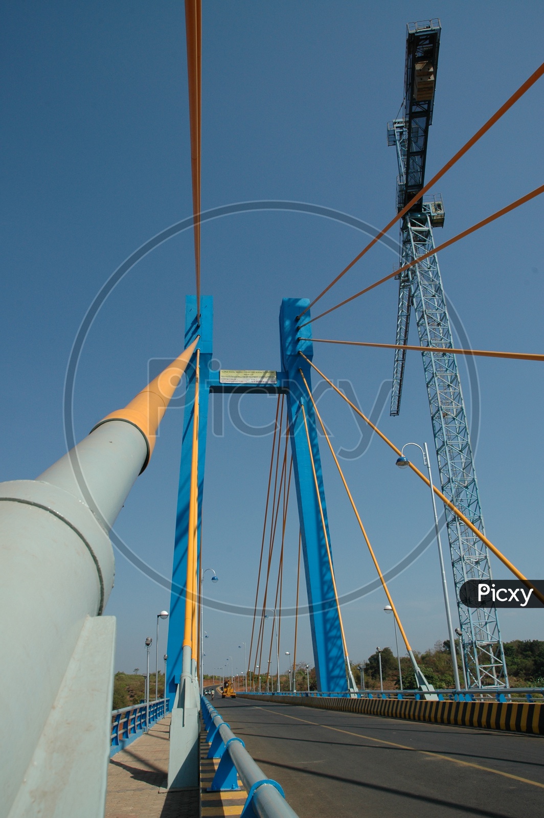 A crane on the cable stayed bridge connecting Aldona and Corjuem