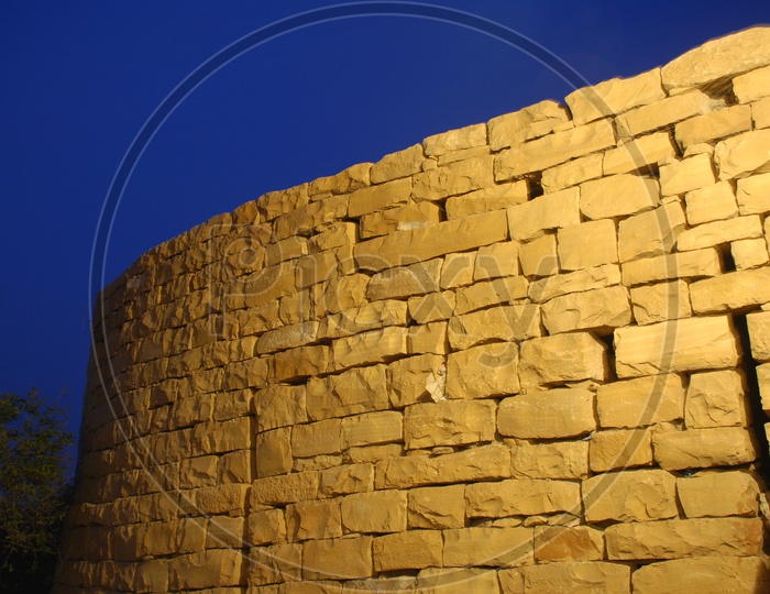 Sandstone brick wall at night