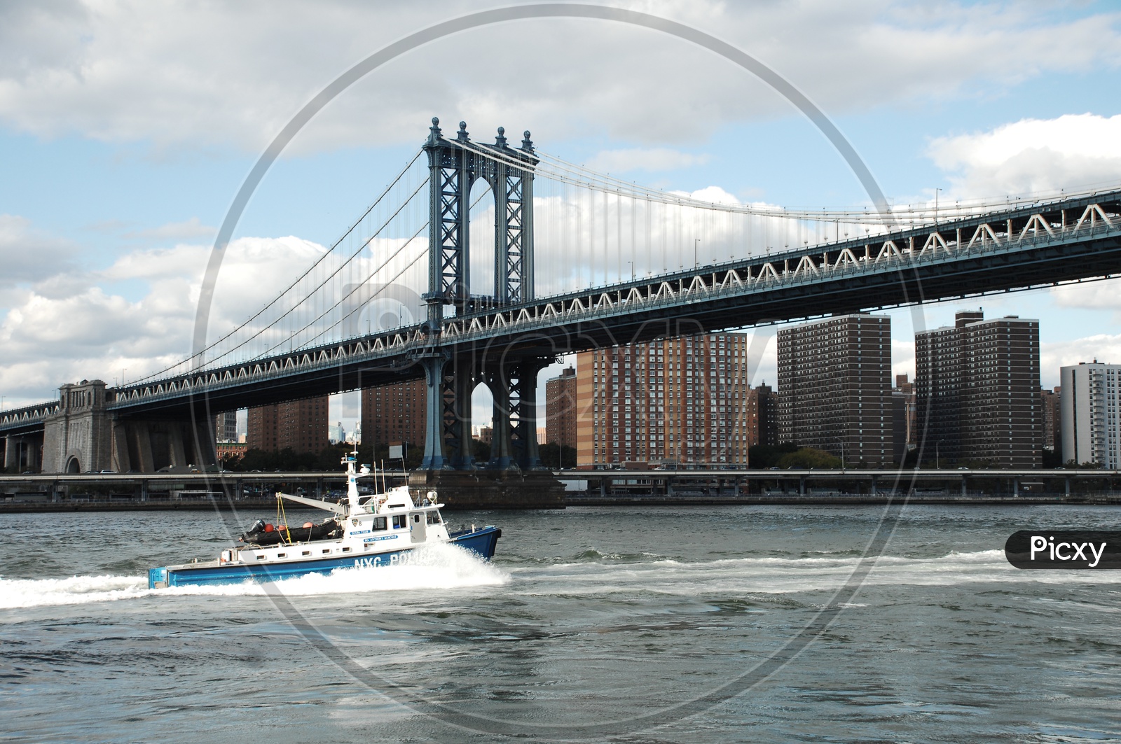 NYC Police patrol boat in the East river near Manhattan bridge