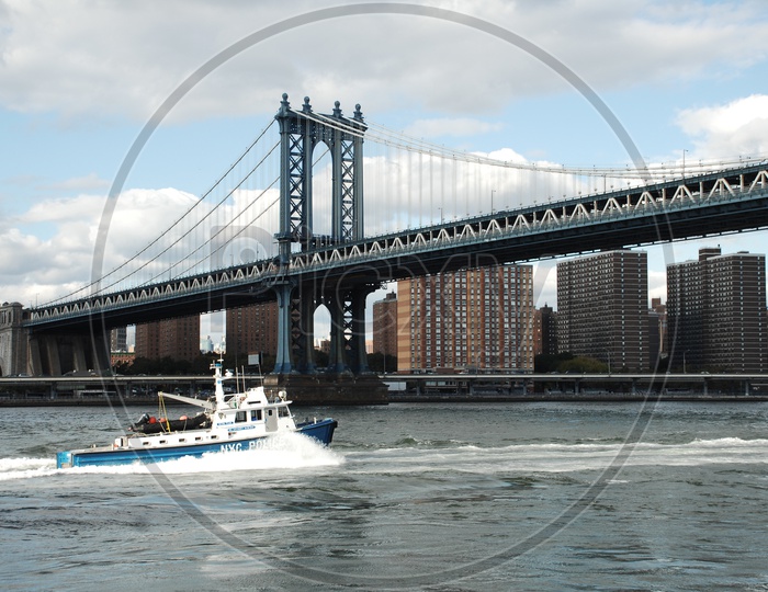 NYC Police patrol boat in the East river near Manhattan bridge