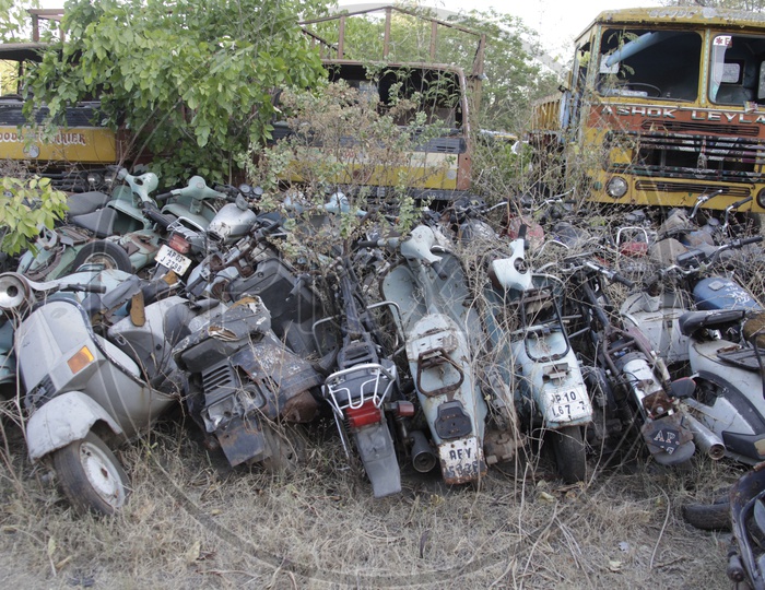 Old Rusted And Wrecked Scooters and lorries