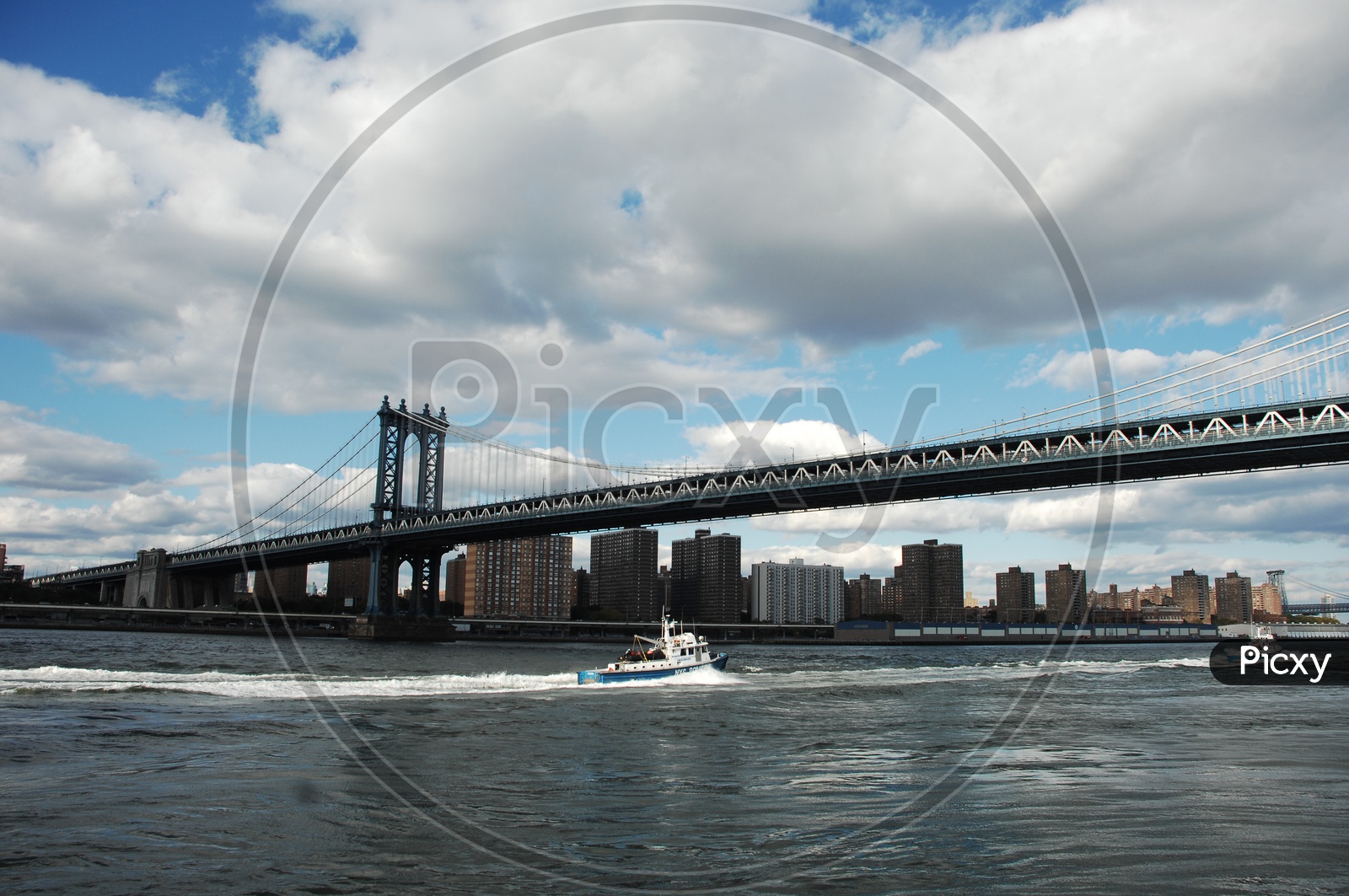 NYC police patrol boat in the East river near the Manhattan bridge