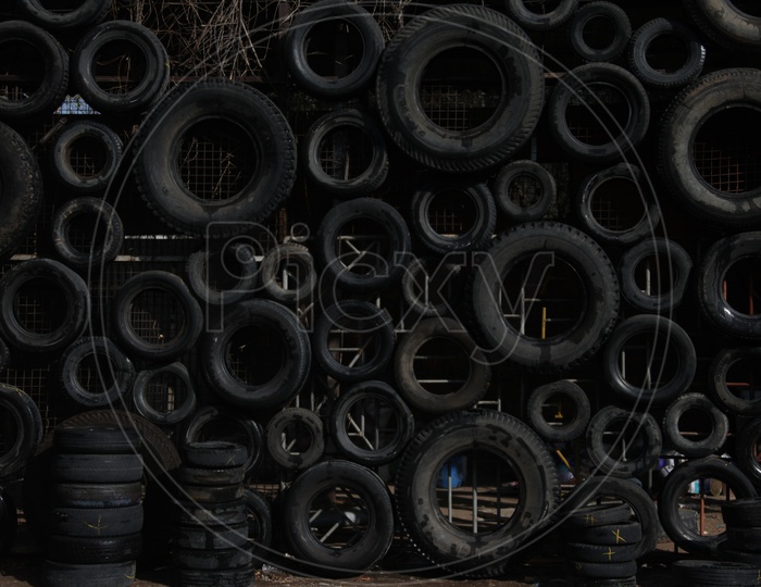 Tyres Arranged on a Wall In  a Manner  Forming  a Background