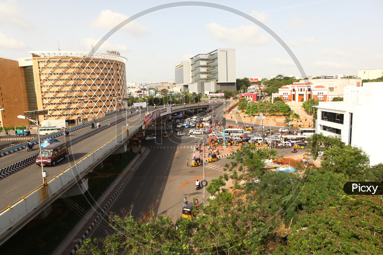 Image of View of the Cyber Towers building in Hyderabad with vehicles  moving in the foreground-SQ359289-Picxy