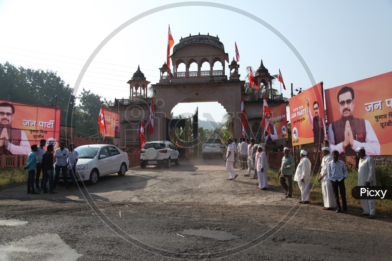 Political Party meeting entrance. Hoardings and workers of the party around