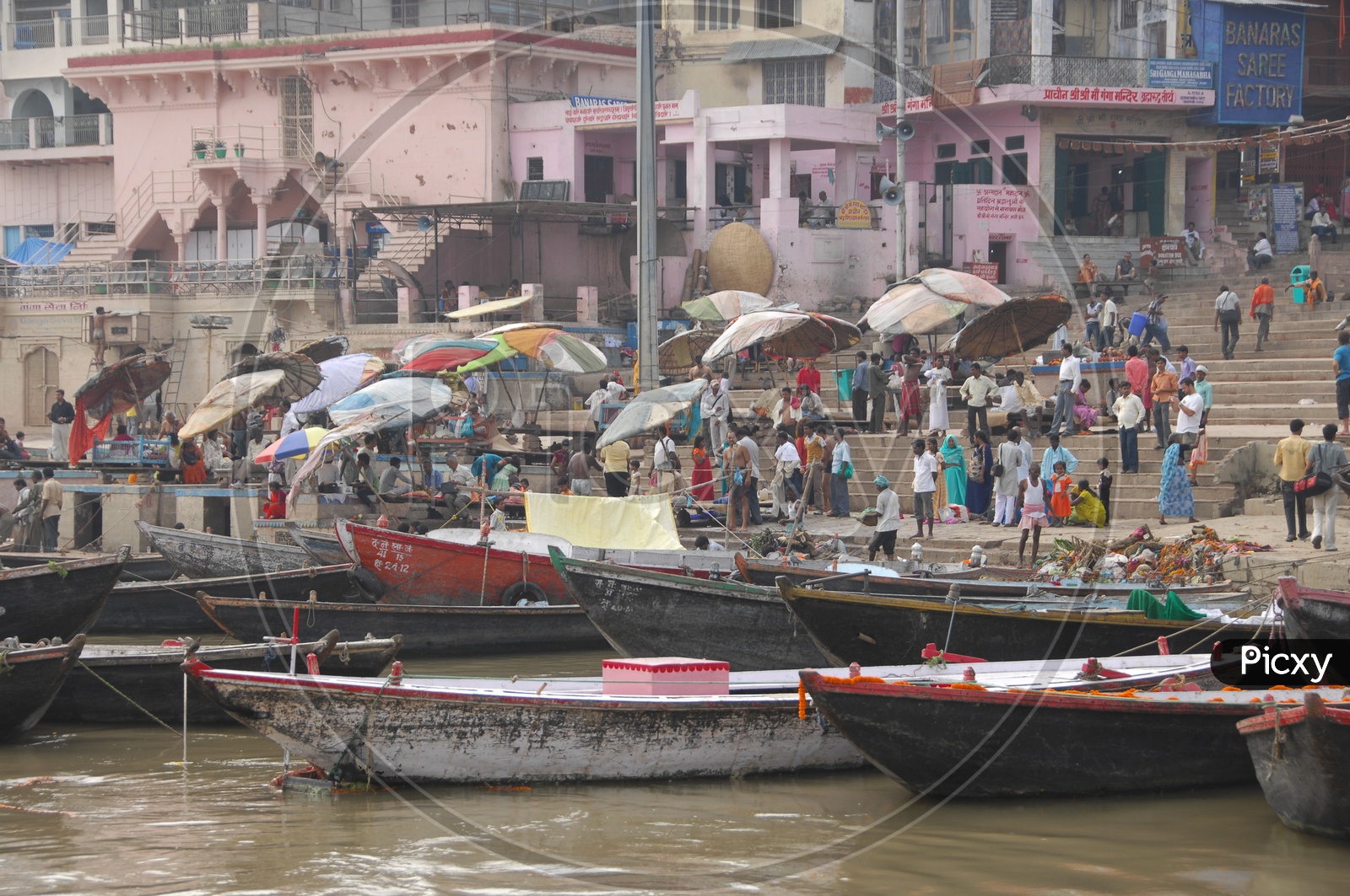Boats and tourists in the river along the varanasi Ghats