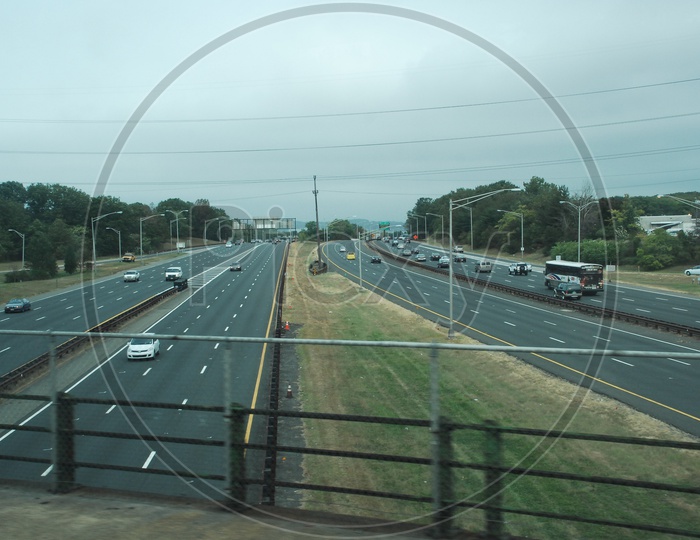 Controlled-access highway view with movie cars