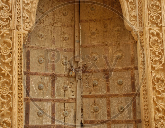 Old wooden arch door of an ancient Building