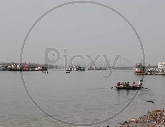 Local People sailing the boat in the Hooghly River