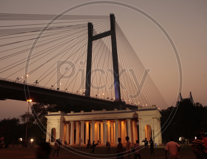 Night view at James Prinsep memorial ghat over looking Vidyasagar Setu bridge in Kolkata