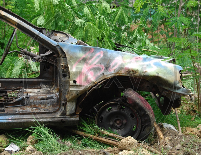 Old Rusted and Wrecked Car in a Place