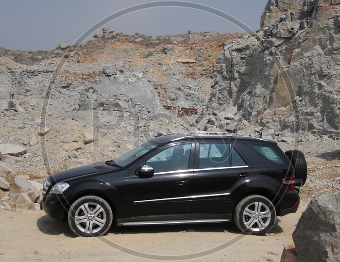 A Black Colour Car in a Quarry