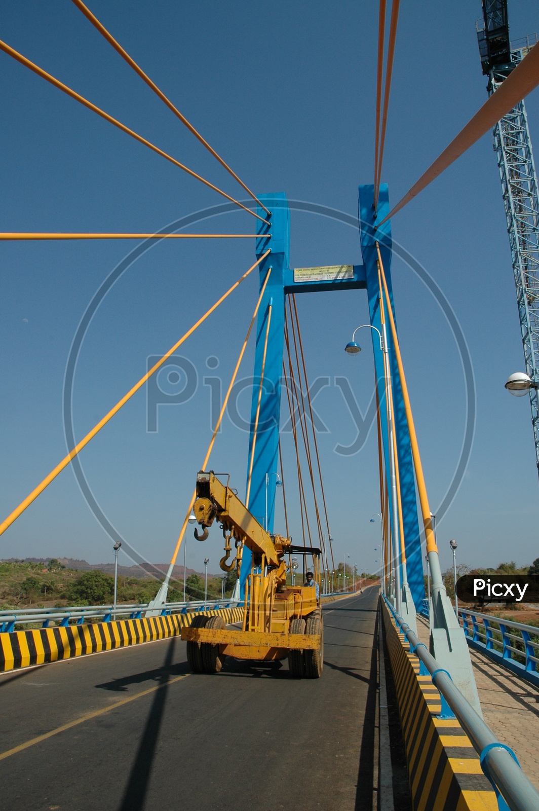 A crane on the cable stayed bridge connecting Aldona and Corjuem