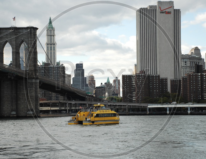New York water taxi in the East river near Brooklyn bridge