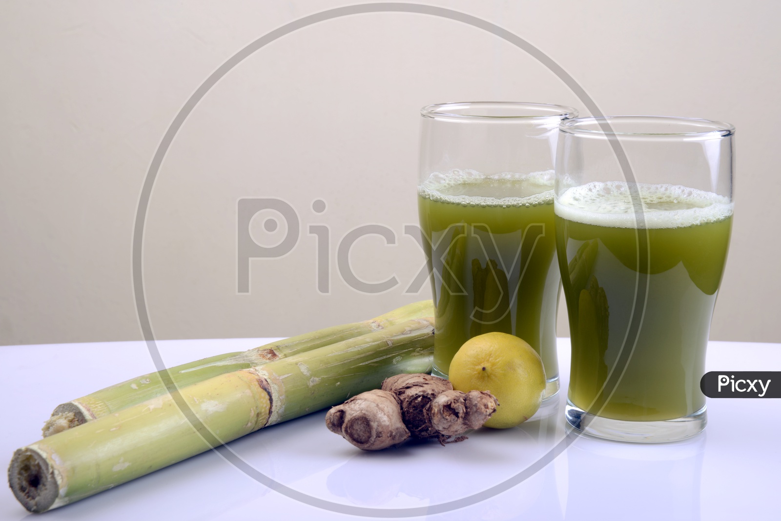 Sugarcane juice with lemon ,  ginger and sugar cane
