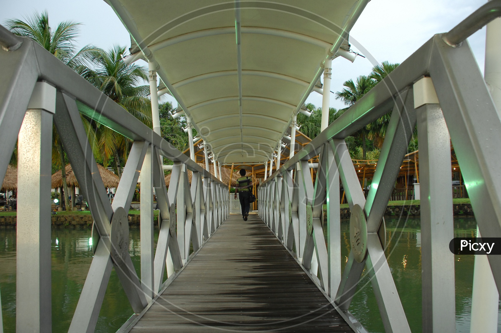 Boardwalk of the bridge alongside a resort