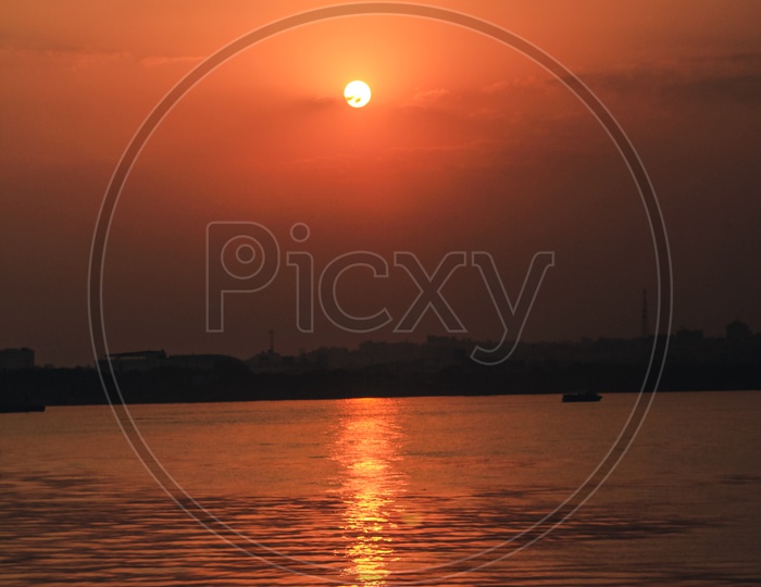 Sunset Over Hussainsagar Lake With Telangana  Tourism Boats