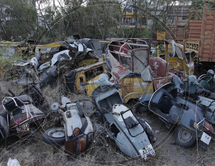 Old Rusted And Wrecked Scooters In a Place