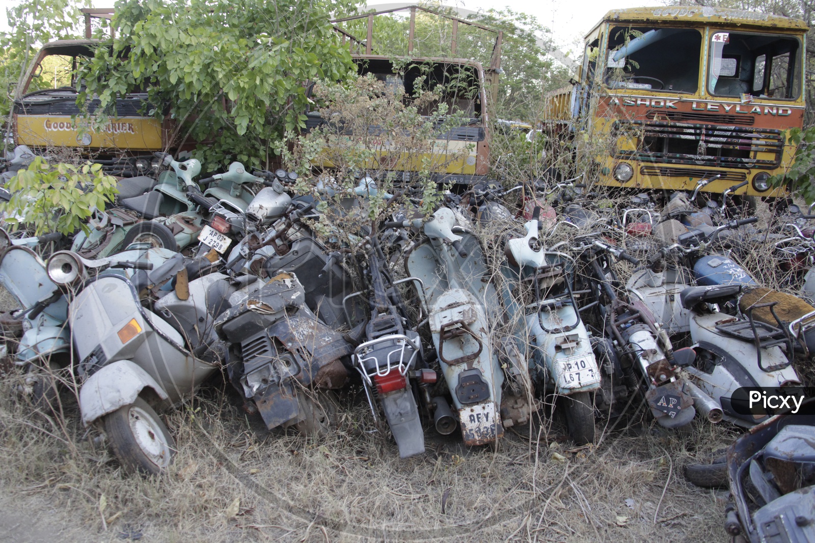Old Rusted And Wrecked Scooters and lorries