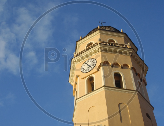Clock tower with blue sky in background