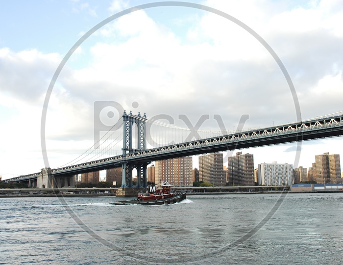 Beautiful view of Manhattan  bridge with river in the foreground